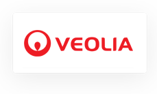Veolia logo in red, featuring a circular abstract symbol to the left of the company name on a white background.